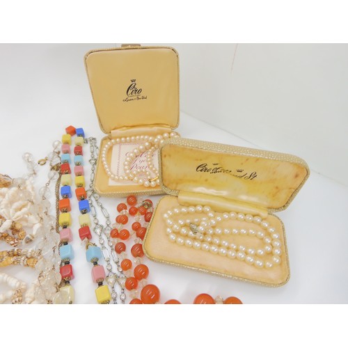 899B - A colection of vintage costume jewellery to include carnelian beads, deco clips, glass gem necklace ... 