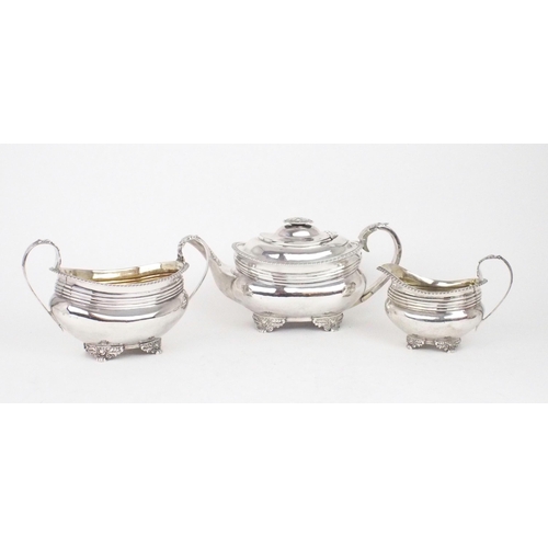 2466 - A MATCHED GEORGE III THREE PIECE SILVER TEA SERVICEof squat shaped rectangular form, the bodies with... 