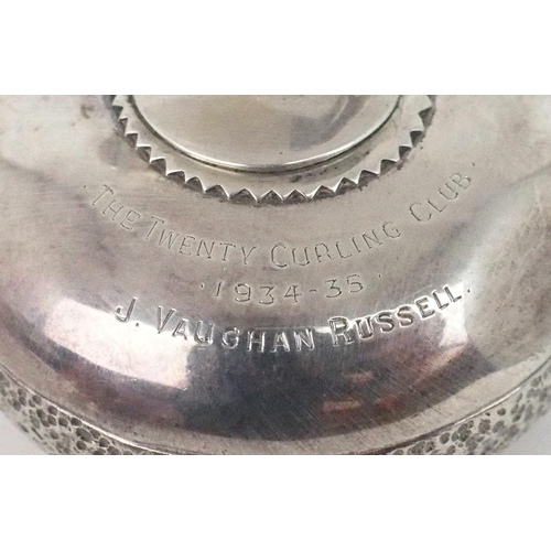 2468 - A GEORGE V NOVELTY SILVER PAPERWEIGHTmodelled as a curling stone, with inscription 'The Twenty Curli... 