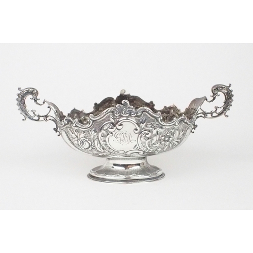 2469 - A PAIR OF EDWARDIAN SILVER FRUIT BOWLSof oval form, the bodies with chased and repousse scrolling fo... 