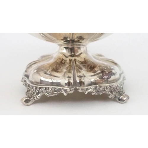 2470 - AN EDWARDIAN SILVER TAZZAof square form, with a cast openwork scrolling foliate rim, the two corners... 