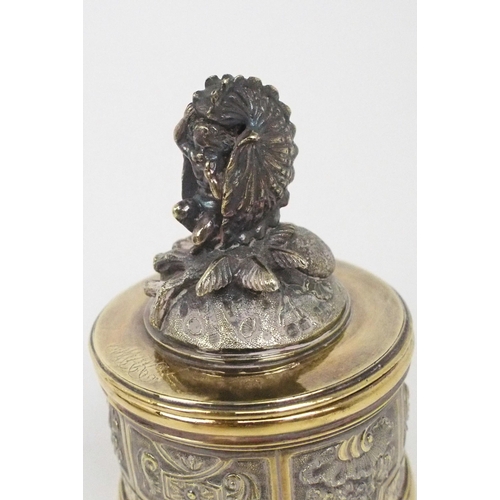 2474 - A GEORGE IV SILVER GILT INKSTANDof oblong lobed form, with a cast scrolling shellwork border, on fou... 