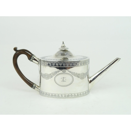 2476 - A GEORGE III SILVER TEAPOTof oval form, the body with engraved floral swags and fleur de lys banding... 