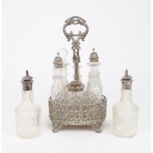 2480 - A MATCHED VICTORIAN SILVER CRUET STANDof oval form, the body of scrolling foliate openwork, on four ... 