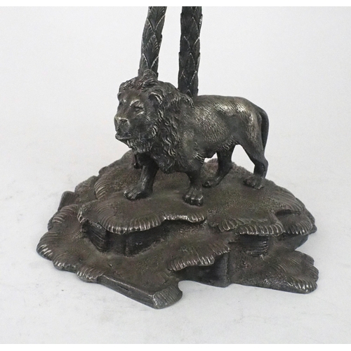 2485 - AN EPNS CUT GLASS CENTREPIECEin the style of Elkington & Co, modelled as a lion standing on a le... 