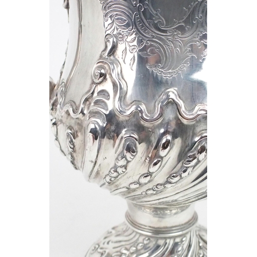 2492 - A GEORGE III SILVER TWIN HANDLED CUP AND COVERthe baluster form body embossed with spiral fluting de... 