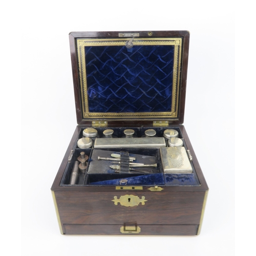 2493 - A VICTORIAN BRASS BOUND MAHOGANY TRAVELLING TOILETRY BOXcomprising silver topped vanity jars and sce... 