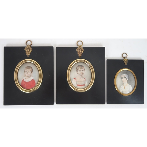 2598 - THREE REGENCY PORTRAIT MINIATURES PAINTED ON IVORYIn ebonised frames, comprising a lady with ringlet... 