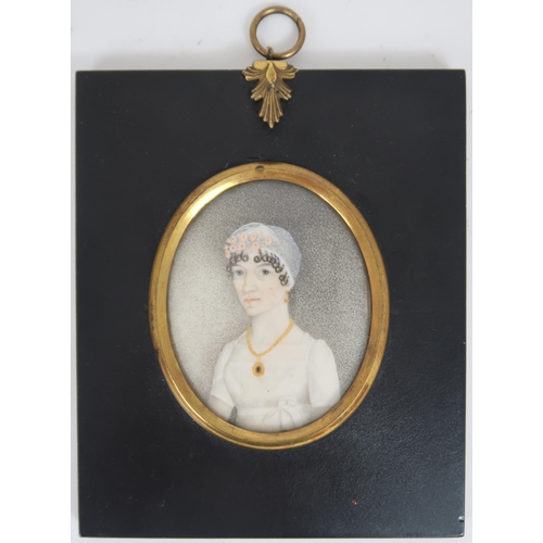 2598 - THREE REGENCY PORTRAIT MINIATURES PAINTED ON IVORYIn ebonised frames, comprising a lady with ringlet... 