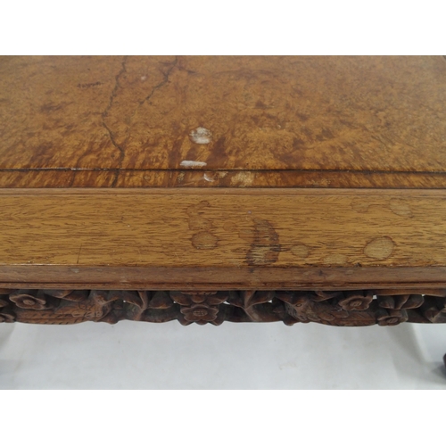 2005 - A 20TH CENTURY CHINESE HARDWOOD LOW TABLEwith central birds eye maple panel, carved floral fretwork ... 