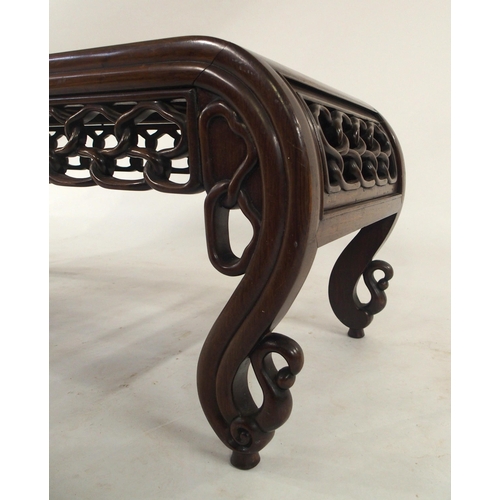 2006 - A 20TH CENTURY CHINESE HARDWOOD LOW TABLEwith carved fretwork bowed ends and friezes, 41cm high x 10... 