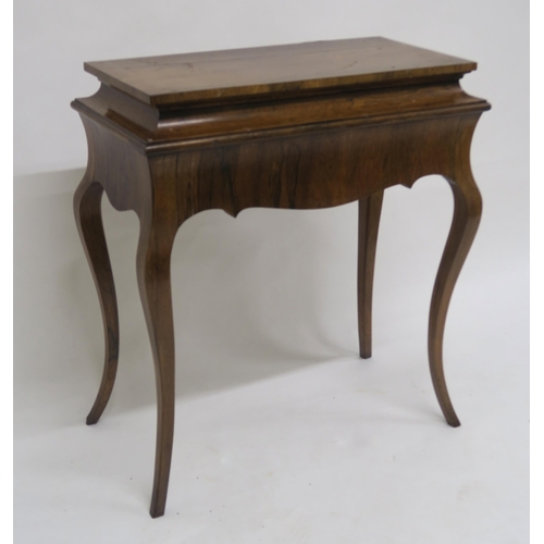 2012 - A VICTORIAN ROSEWOOD JARDINIERE TABLEwith removable rosewood top over shaped frieze on cabriole supp... 
