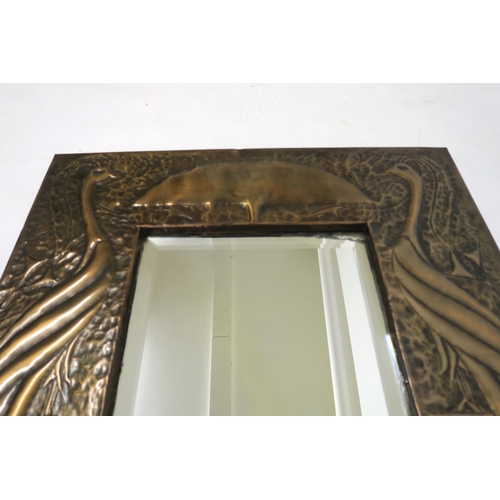 2016 - AN EARLY 20TH CENTURY ARTS & CRAFTS HAMMERED COPPER FRAMED BEVELLED GLASS WALL MIRRORwith centra... 