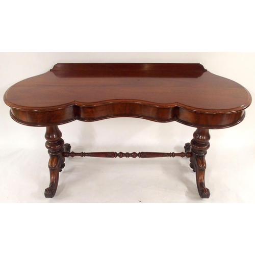 2017 - A VICTORIAN MAHOGANY CONSOLE TABLEwith shaped top on stretchered pedestal supports with out swept fe... 