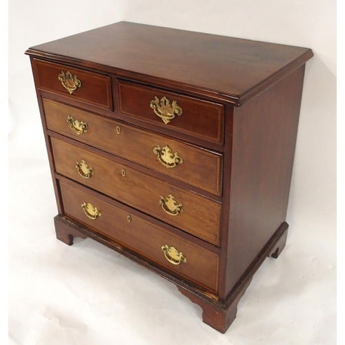 2019 - A GEORGIAN MAHOGANY TWO OVER THREE CHEST OF DRAWERSwith checker line inlays and brass drawer pulls o... 