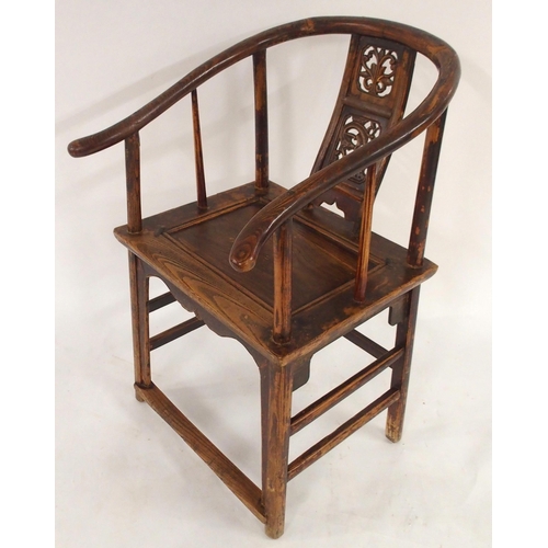 2024 - A CHINESE HARDWOOD HORSESHOE SHAPED ARMCHAIRwith carved fret work splat on stretchered supports with... 