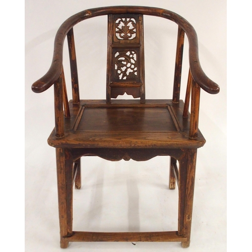 2024 - A CHINESE HARDWOOD HORSESHOE SHAPED ARMCHAIRwith carved fret work splat on stretchered supports with... 