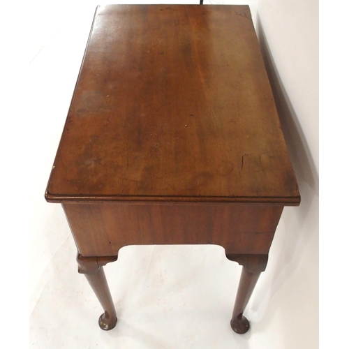 2029 - A GEORGIAN MAHOGANY LOWBOYwith three short drawers with brass drawer pulls over shaped frieze on tur... 