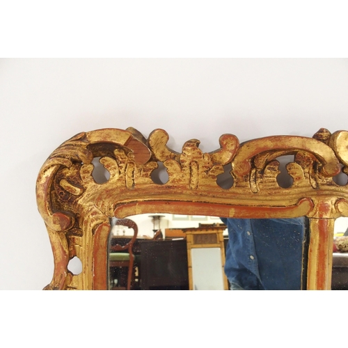 2034 - AN 18TH CENTURY STYLE GILTWOOD ROCOCO STYLE TRIPLE PLATE WALL MIRRORwith floral surmount over centra... 