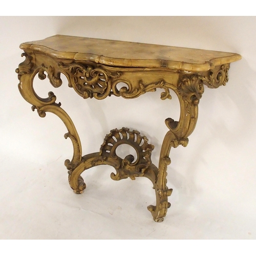 2036 - A 19TH CENTURY GILTWOOD AND GESSO CONSOLE TABLEwith serpentine front faux marble top over Rococo sty... 