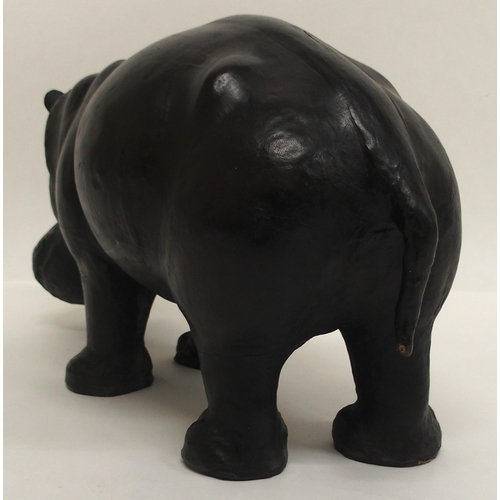 2042 - AN EARLY 20TH CENTURY LIBERTY OF LONDON STYLE LEATHER HIPPOPOTAMUS FOOTSTOOLwith glass eyes, 32cm hi... 