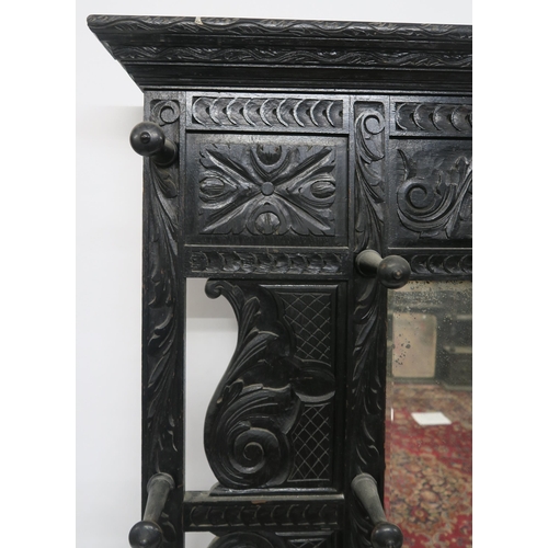 2047 - A VICTORIAN EBONISED JACOBEAN REVIVAL MIRROR BACK HALL STANDwith rectangular bevelled glass mirror f... 