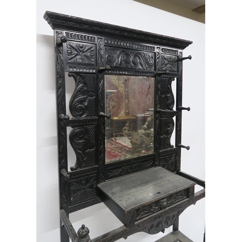 2047 - A VICTORIAN EBONISED JACOBEAN REVIVAL MIRROR BACK HALL STANDwith rectangular bevelled glass mirror f... 