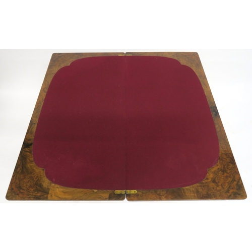 2049 - A VICTORIAN BURR WALNUT FOLD-OVER CARD TABLEwith rectangular quarter-veneered top concealing shaped ... 