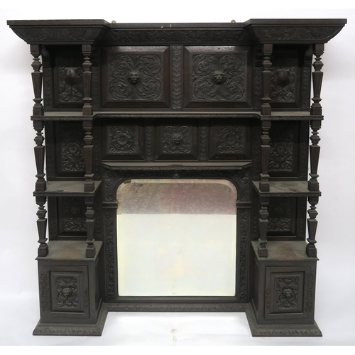 2050 - A VICTORIAN STAINED OAK BARONIAL STYLE OVERMANTLE MIRRORwith shaped bevelled glass mirror flanked by... 