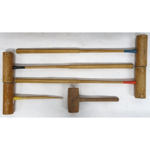 2054 - AN EARLY 20TH CENTURY CASED CROQUET SETcomprising four mallets (one def), seven balls, three steel h... 