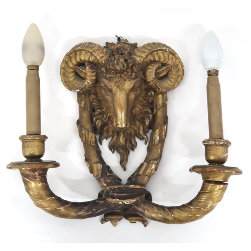 2063 - A PAIR OF GILT GESSO TWO BRANCH WALL SCONCESeach sconce modelled with rams heads over branches with ... 