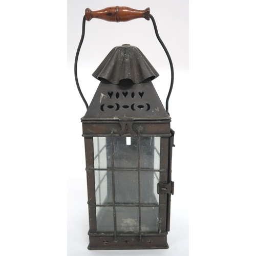 2065 - AN EARLY 20TH CENTURY ARTS & CRAFTS CANDLE LANTERNwith swing handle over pierced decoration over... 