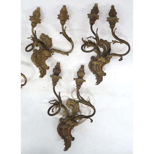 2066 - A LOT OF FIVE ROCOCO STYLE GILT METAL ORMOLU TWO BRANCH WALL SCONCESwith scroll and acanthus back pl... 