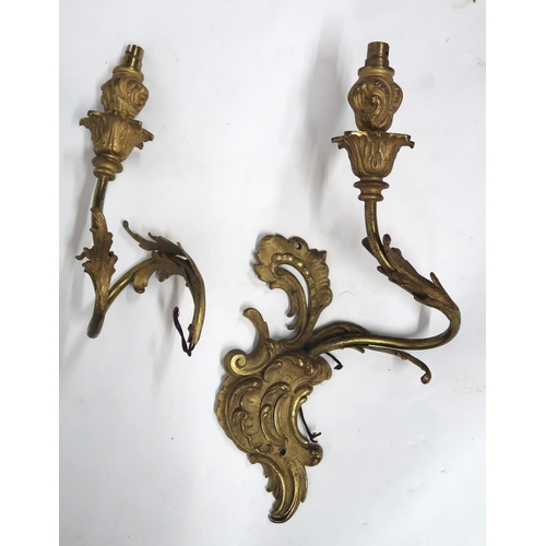 2066 - A LOT OF FIVE ROCOCO STYLE GILT METAL ORMOLU TWO BRANCH WALL SCONCESwith scroll and acanthus back pl... 