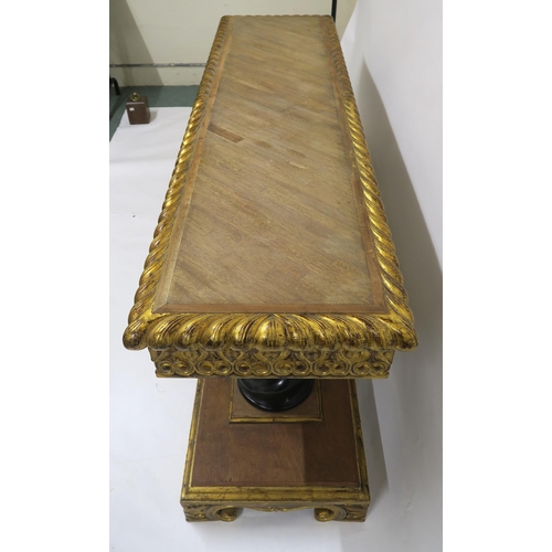 2103 - A 20TH CENTURY GILTWOOD AND MAHOGANY ALTAR TABLEwith parquetry top over carved giltwood friezes on t... 