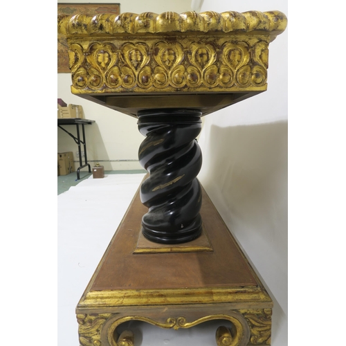 2103 - A 20TH CENTURY GILTWOOD AND MAHOGANY ALTAR TABLEwith parquetry top over carved giltwood friezes on t... 