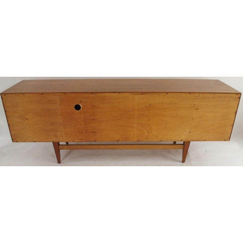 2105 - *WITHDRAWN* A MID 20TH CENTURY ROSEWOOD AND TEAK SIDEBOARDwith three rosewood veneered central drawe... 