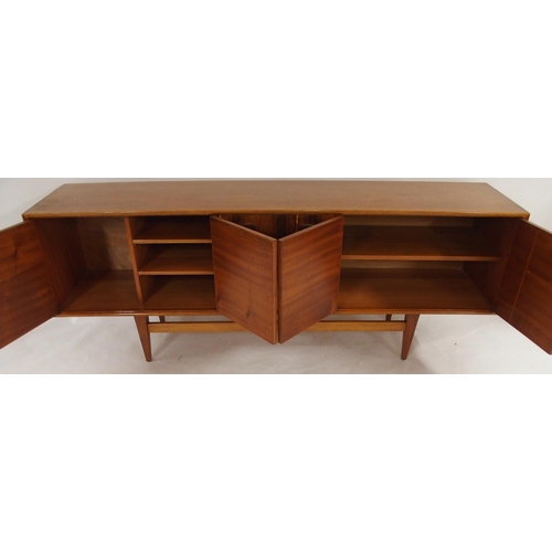 2105 - *WITHDRAWN* A MID 20TH CENTURY ROSEWOOD AND TEAK SIDEBOARDwith three rosewood veneered central drawe... 