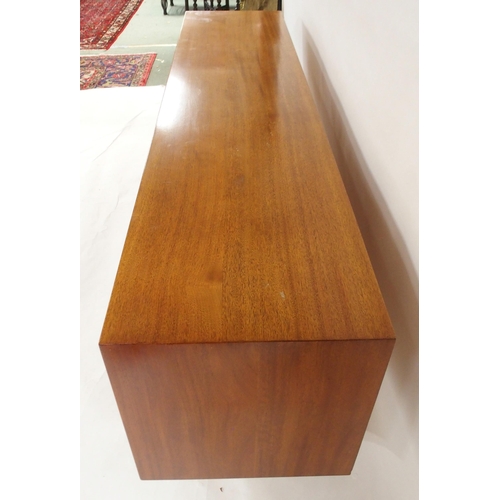 2105 - *WITHDRAWN* A MID 20TH CENTURY ROSEWOOD AND TEAK SIDEBOARDwith three rosewood veneered central drawe... 