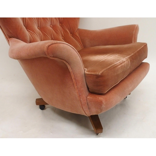 2106 - A MID 20TH CENTURY G PLAN MODEL 6250 SWIVEL WING BACK ARMCHAIRwith pick velour button back upholster... 