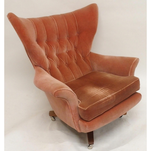 2106 - A MID 20TH CENTURY G PLAN MODEL 6250 SWIVEL WING BACK ARMCHAIRwith pick velour button back upholster... 