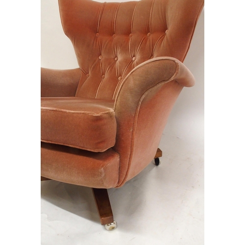 2107 - A MID 20TH CENTURY G PLAN MODEL 6250 SWIVEL WING BACK ARMCHAIRwith pick velour button back upholster... 