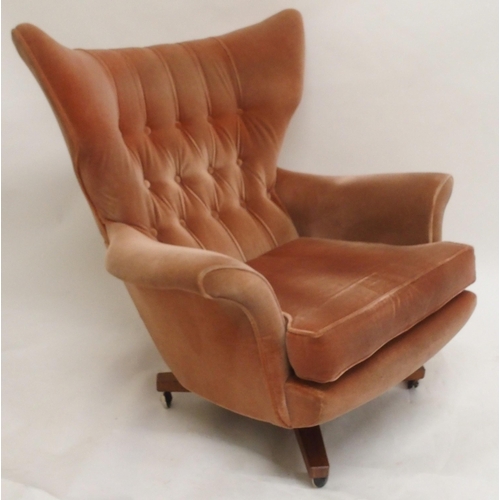 2107 - A MID 20TH CENTURY G PLAN MODEL 6250 SWIVEL WING BACK ARMCHAIRwith pick velour button back upholster... 