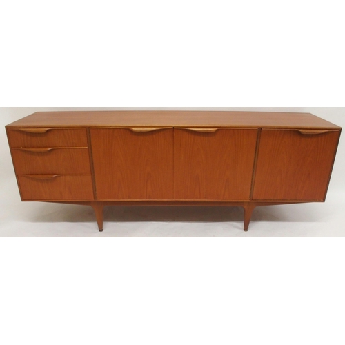 2108 - A MID 20TH CENTURY TEAK A.H. MCINTOSH OF KIRKCALDY SIDEBOARDwith pair of cabinet doors flanked by th... 