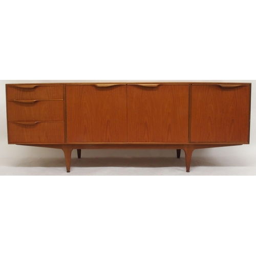 2108 - A MID 20TH CENTURY TEAK A.H. MCINTOSH OF KIRKCALDY SIDEBOARDwith pair of cabinet doors flanked by th... 