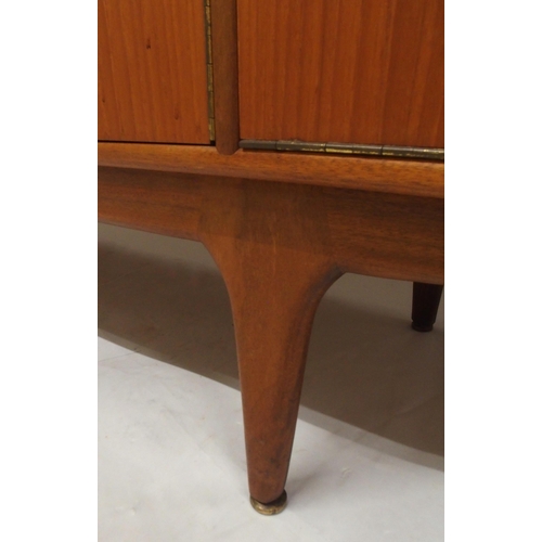 2108 - A MID 20TH CENTURY TEAK A.H. MCINTOSH OF KIRKCALDY SIDEBOARDwith pair of cabinet doors flanked by th... 