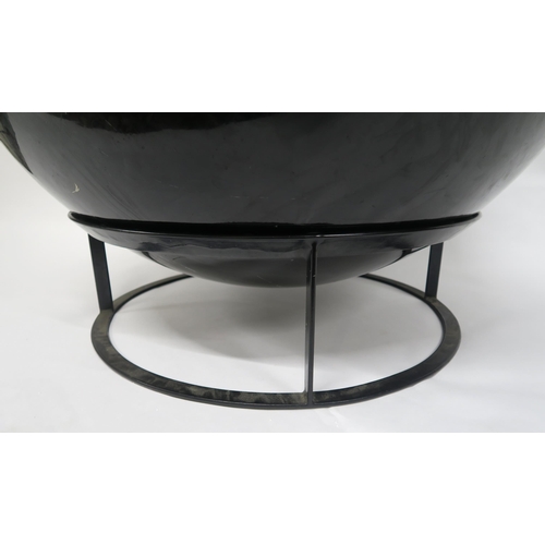 2110 - A 20TH CENTURY AFTER EERO AARNIO BALL CHAIRwith black leather upholstered bean bag seat within fibre... 