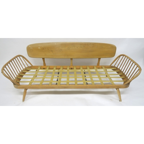 2111 - A MID 20TH CENTURY ELM AND BEECH FRAMED ERCOL DAY BEDwith floral upholstered cushions, 77cm high x 2... 