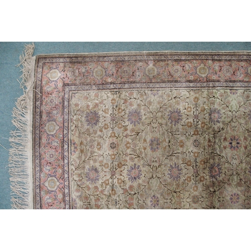 2131 - A CREAM GROUND SILK AND WOOL PERSIAN RUGwith floral foliate all-over design and pink borders, 185cm ... 