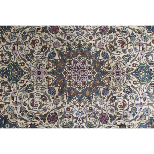 2136 - A CREAM GROUND MESHED RUGwith blue starburst central medallion, matching spandrels and floral multic... 